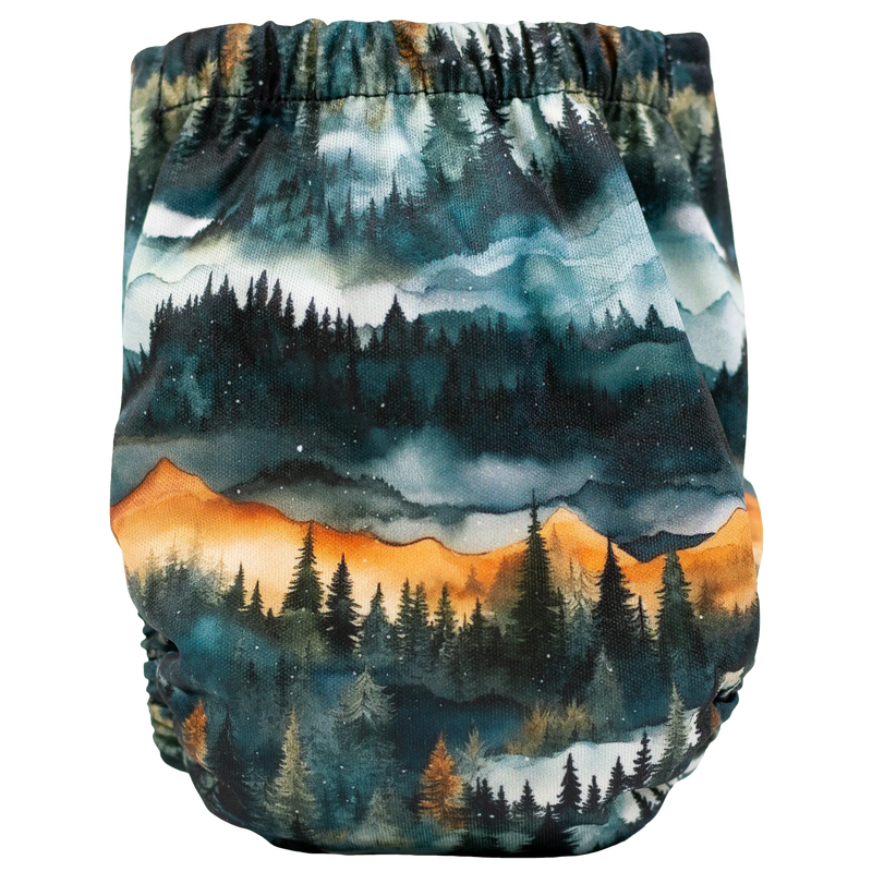 Tiny Tushies Newborn AIO Cloth Diaper with forest print design.