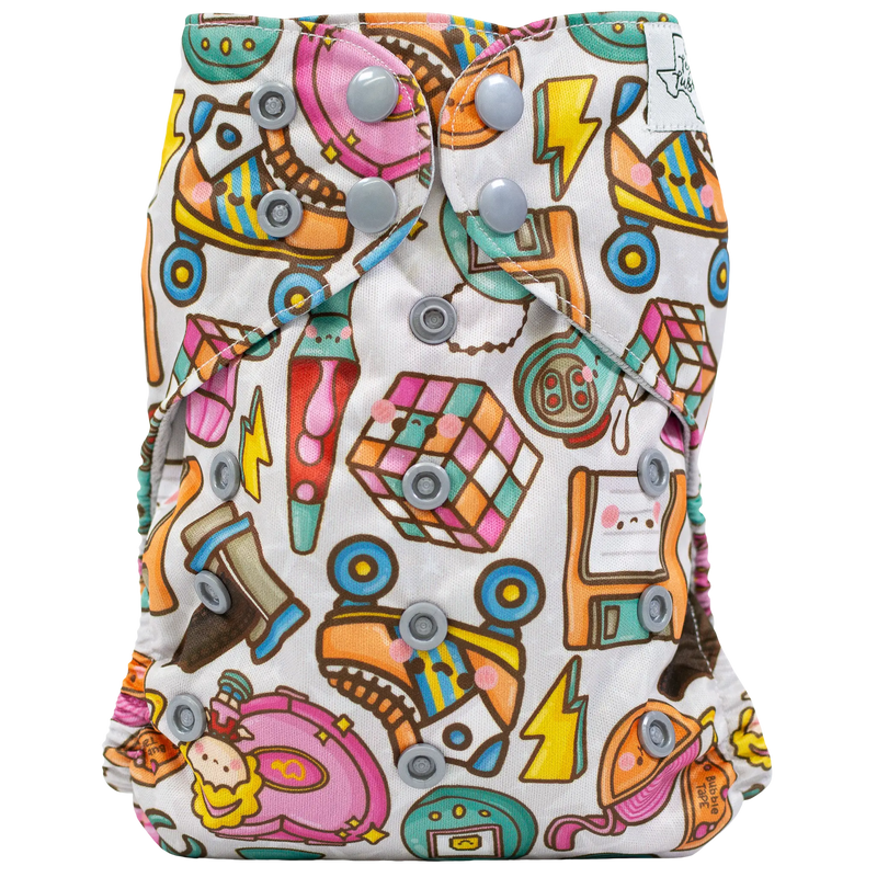 Slim fit pocket cloth diaper with colorful print and adjustable snaps.