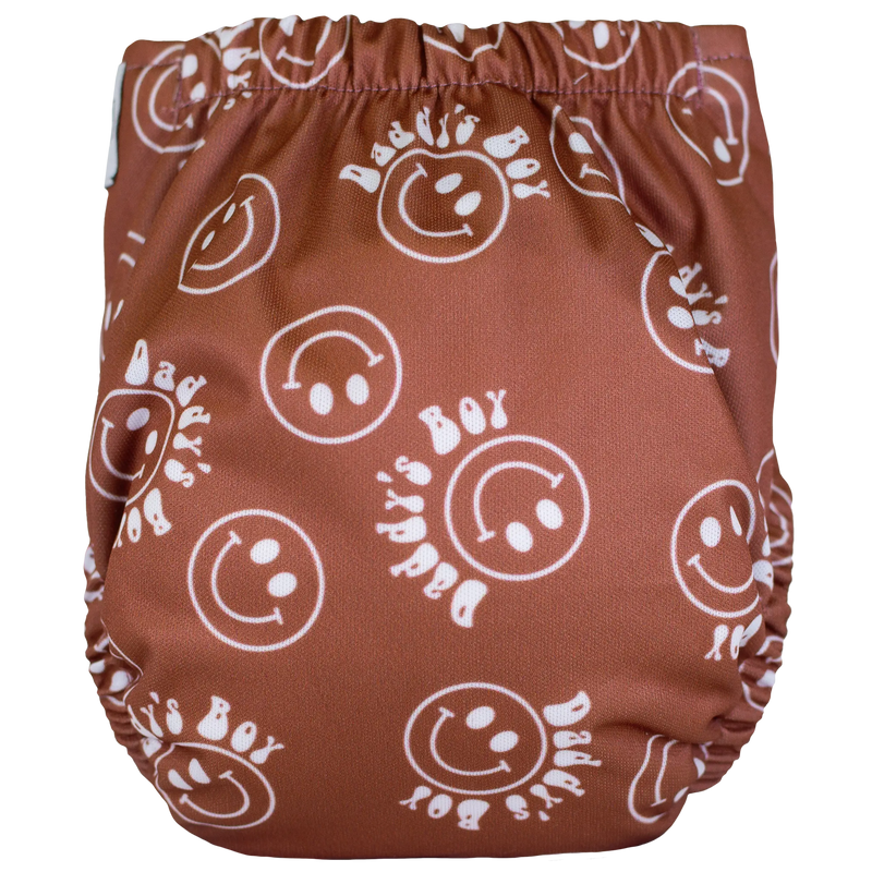 Tiny Tushies Newborn AIO Cloth Diaper with smiley face design.