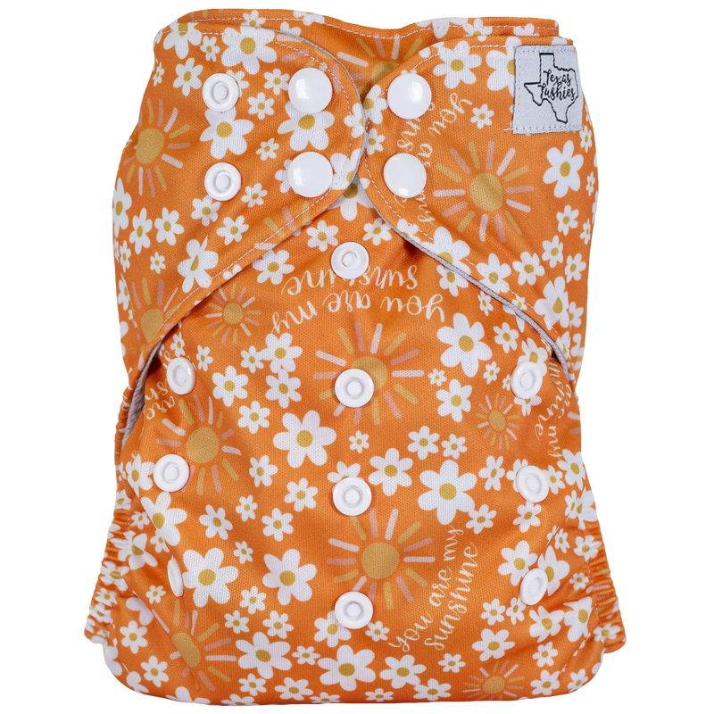 Slim Fit Pocket Cloth Diaper with floral design and adjustable white snaps.