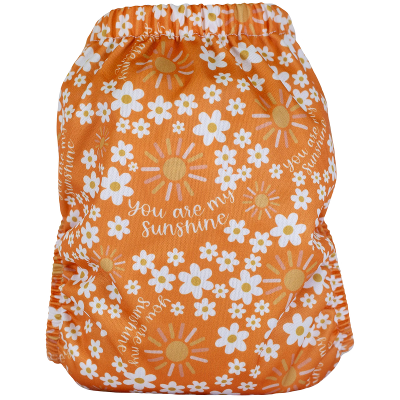 Slim Fit AIO Cloth Diaper with floral sunshine print, suitable for 8-40lbs babies, featuring athletic wicking jersey and secure snaps.