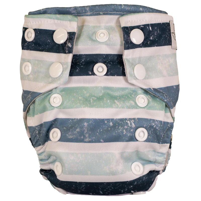 Tiny Tushies Newborn AIO Cloth Diaper with snaps and stripe design.