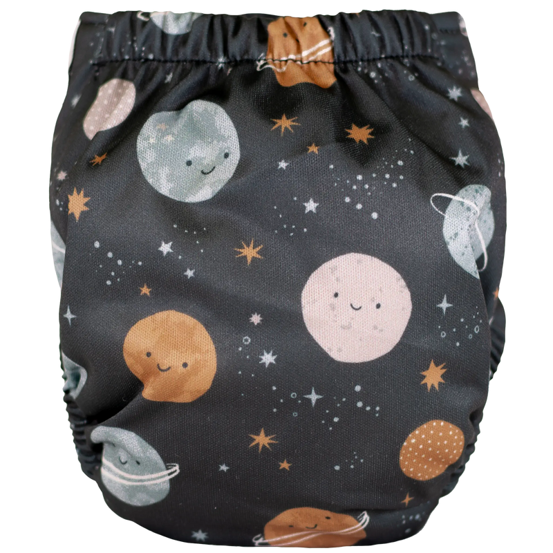 Tiny Tushies Newborn AIO cloth diaper with space-themed print and secure closure snaps.