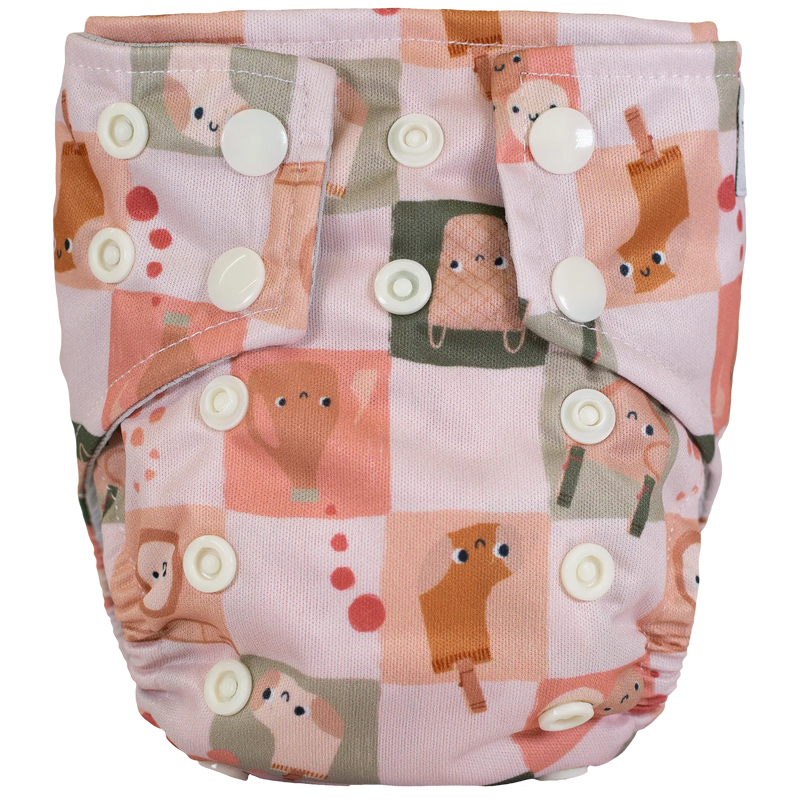 Tiny Tushies Newborn AIO Cloth Diaper with animal print design and adjustable snaps.