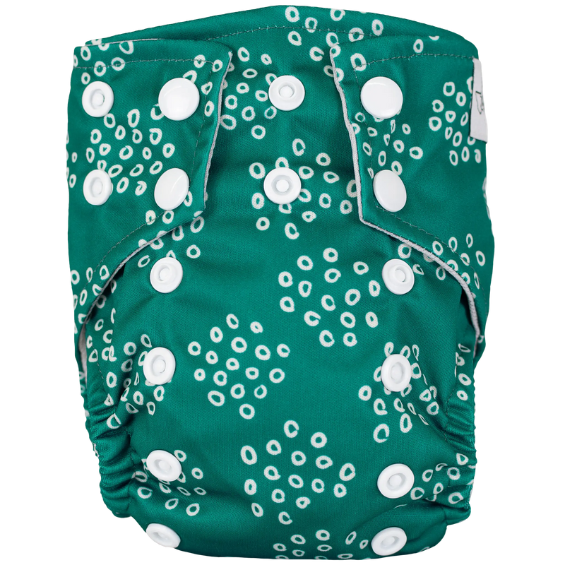 Tiny Tushies Newborn AIO cloth diaper with green pattern and secure snaps.
