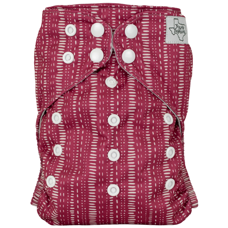 Slim fit pocket cloth diaper with adjustable snaps, red pattern design.