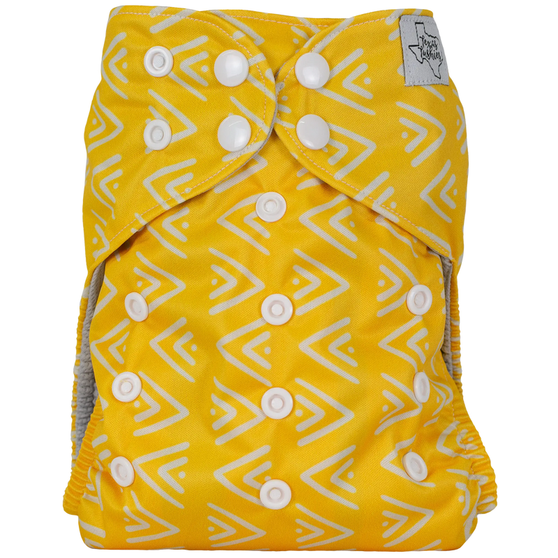 Slim Fit AIO Cloth Diaper in yellow with geometric pattern and adjustable snaps.