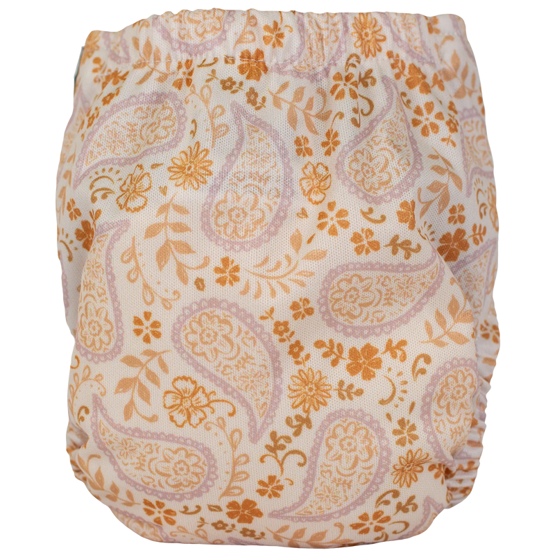Tiny Tushies Newborn AIO Cloth Diaper with floral pattern, suitable for 5-20 lbs babies.