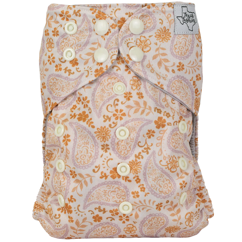 Slim Fit Pocket Cloth Diaper with floral pattern and adjustable snaps.