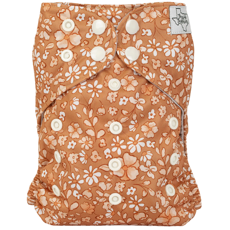 Slim Fit AIO Cloth Diaper with floral pattern and adjustable snaps for babies 8-40lbs.