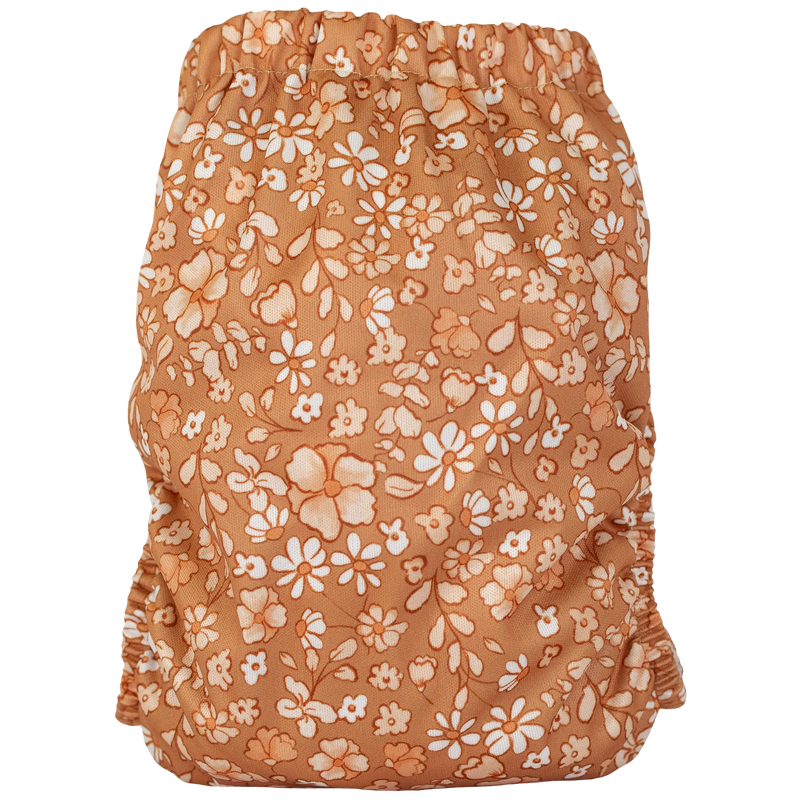 Slim Fit AIO Cloth Diaper with floral pattern, fitting babies 8-40lbs, featuring moisture-wicking material and tummy panels.