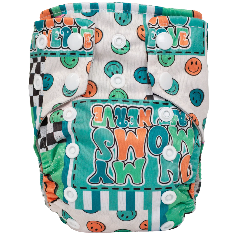Tiny Tushies Newborn AIO Cloth Diaper with colorful pattern and secure snaps, ideal for 5-20 lbs babies.
