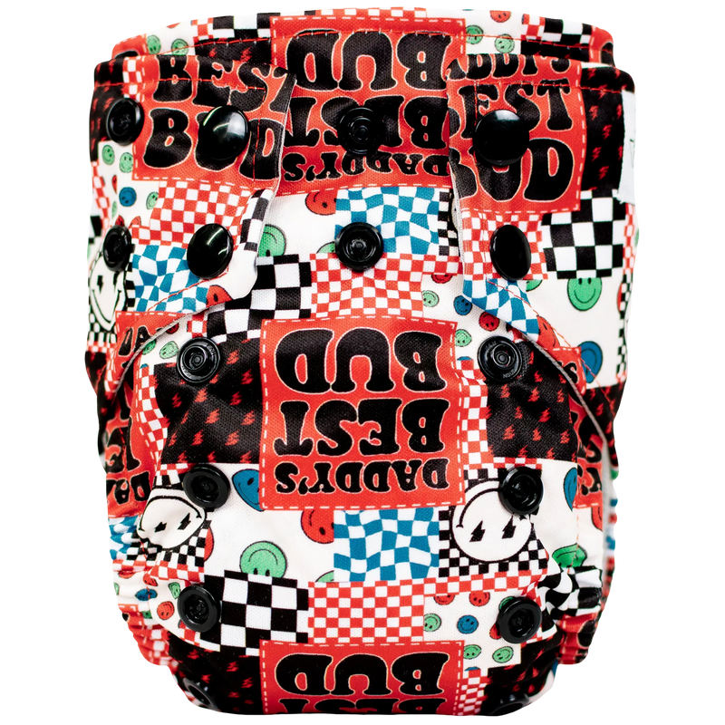 Tiny Tushies Newborn AIO cloth diaper with colorful printed design and secure snaps.