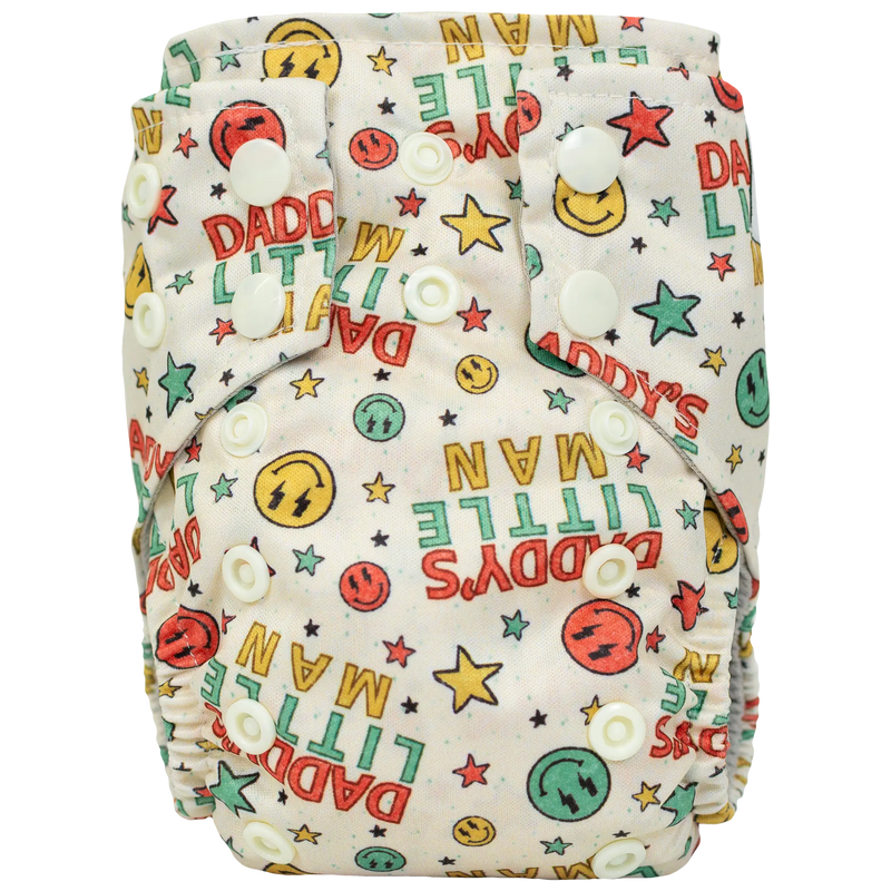 Tiny Tushies Newborn AIO Cloth Diaper with colorful print and adjustable snaps for 5-20 lbs babies.