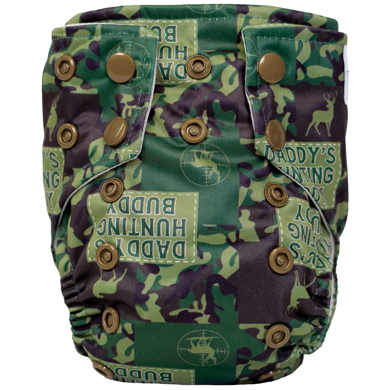 Tiny Tushies Newborn AIO Cloth Diaper with camouflage print and button closures.