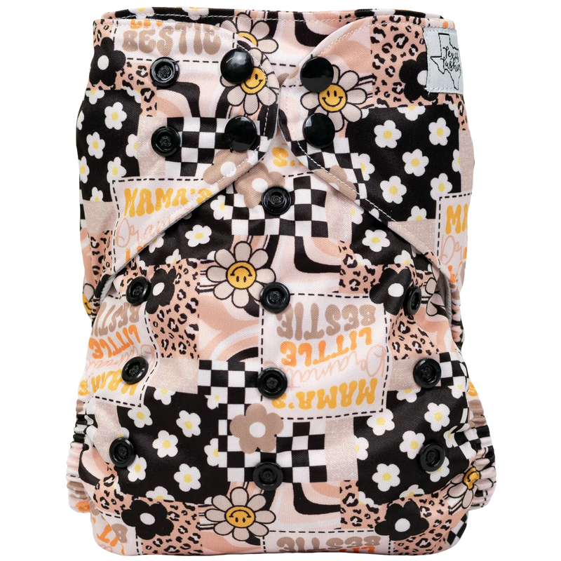 Slim Fit AIO Cloth Diaper with floral and geometric print, featuring adjustable snaps and tummy panels.