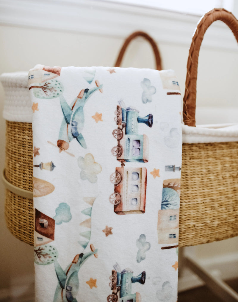 Premium baby and toddler minky blanket with planes and trains pattern, soft and lightweight.