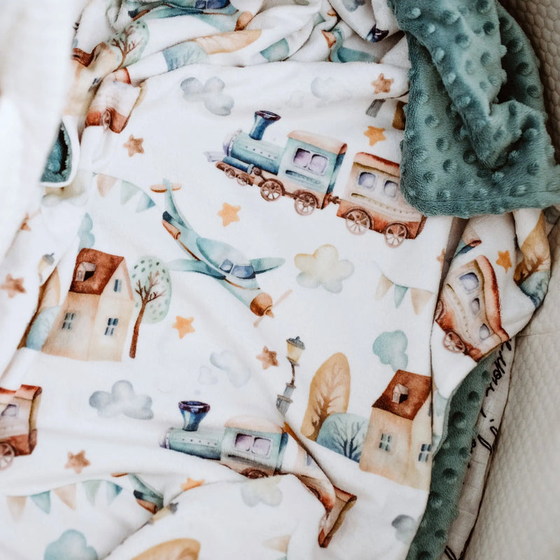 Premium baby & toddler minky blanket with planes, trains, and automobiles design.