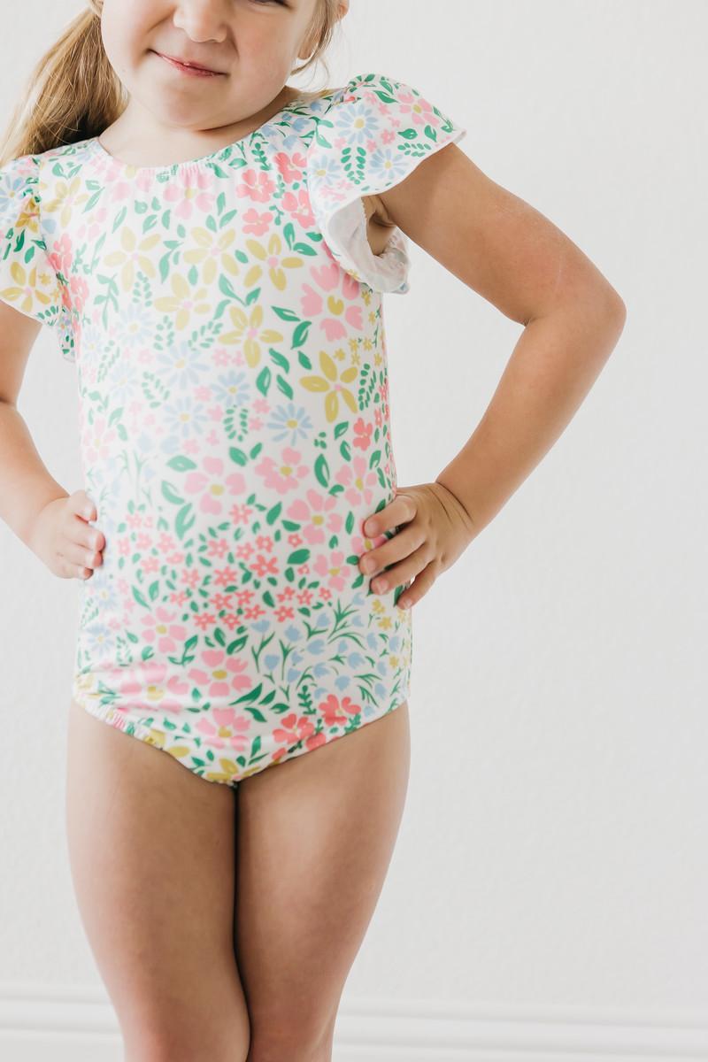 Mila & Rose Daffodils print short sleeve flutter leotard for baby or toddler, front view.