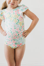 Mila & Rose Daffodils print short sleeve flutter leotard for baby or toddler, front view.