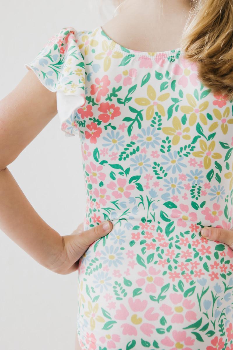 Mila & Rose Daffodils print short sleeve flutter leotard for baby or toddler, front view.