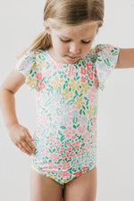 Mila & Rose Daffodils print short sleeve flutter leotard for baby or toddler, front view.