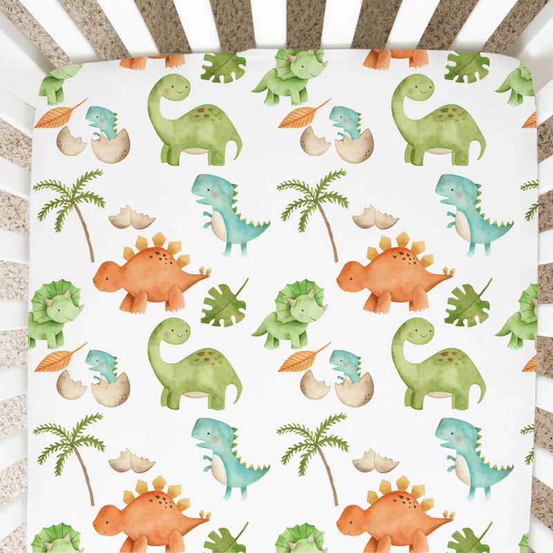 Fitted crib sheet with colorful dinosaur pattern in a standard size crib.