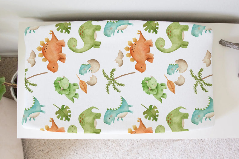 Dinosaurs changing pad cover in soft, stretchy fabric.