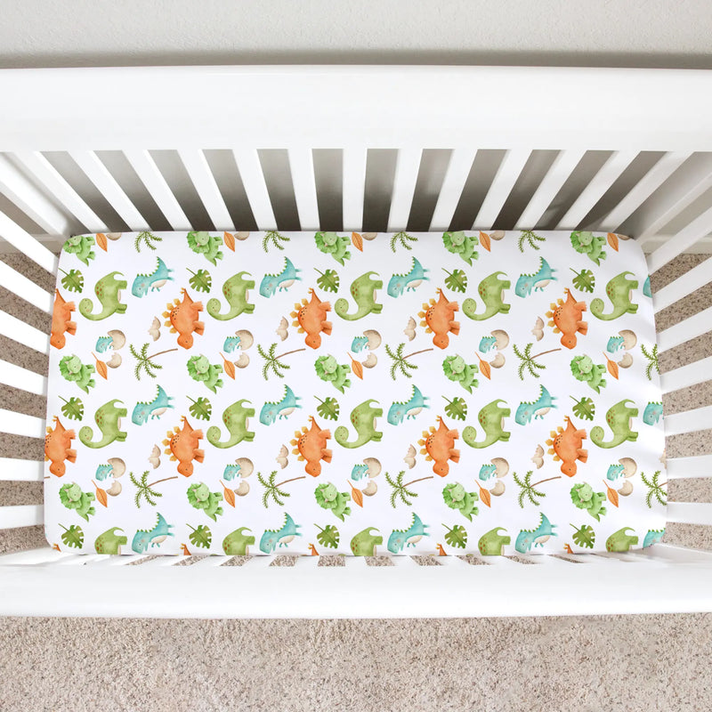 Fitted crib sheet with colorful dinosaur pattern in a standard size crib.