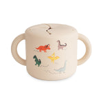 Mushie Silicone Snack Cup with lid, spill-proof design for toddlers and babies, shown in a neutral color.