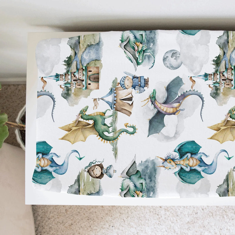 Changing pad cover with dragon and knight design, soft and stretchy fabric, fits most pads.