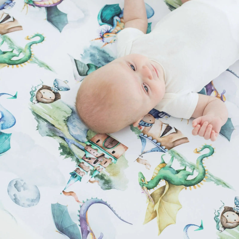 Fitted crib sheet with dragons and knights design, soft and decorative for standard size cribs.