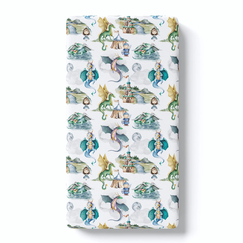 Fitted crib sheet with dragons and knights pattern, soft fabric, standard crib size.