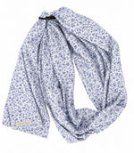 Blue floral ring sling baby carrier with black aluminum rings and long cotton blend tail