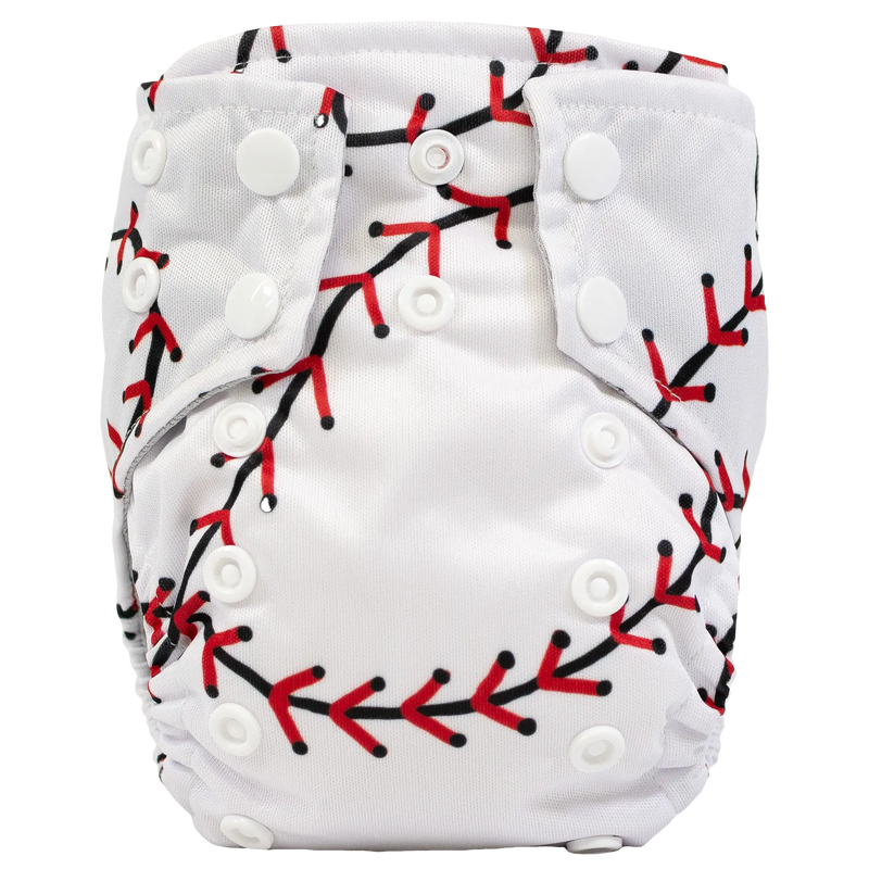Tiny Tushies Newborn AIO Cloth Diaper with snaps and decorative design.