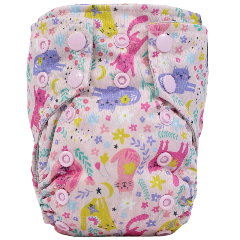 Tiny Tushies Newborn AIO Cloth Diaper with colorful animal print and pink snaps.