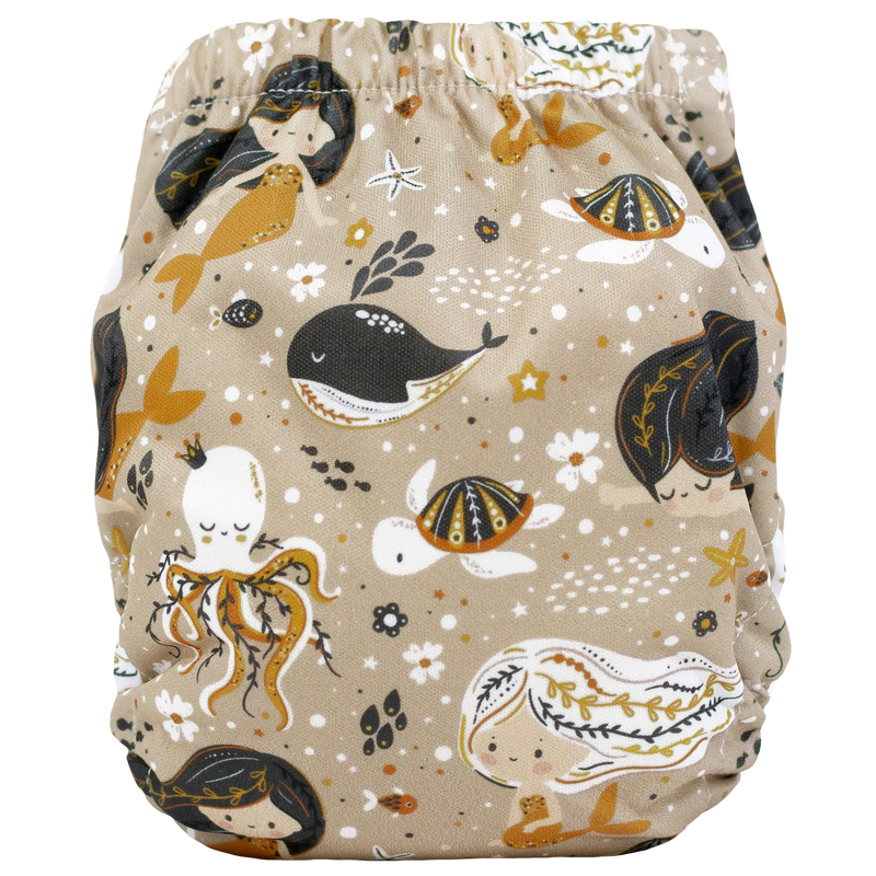Tiny Tushies Newborn AIO Cloth Diaper with ocean-themed print and adjustable fit.
