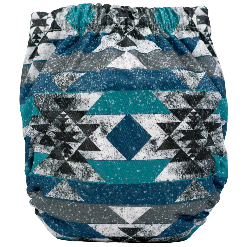 Tiny Tushies Newborn AIO cloth diaper with geometric pattern in blue and gray.