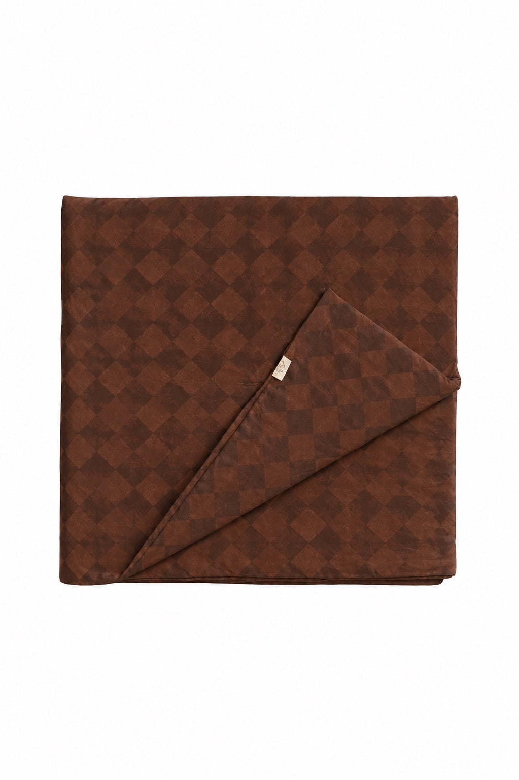 Quilted crib blanket with a brown and white diamond pattern