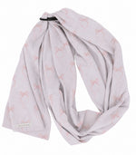 Pink bow print ring sling baby carrier with black aluminum rings and long double-sided fabric tail