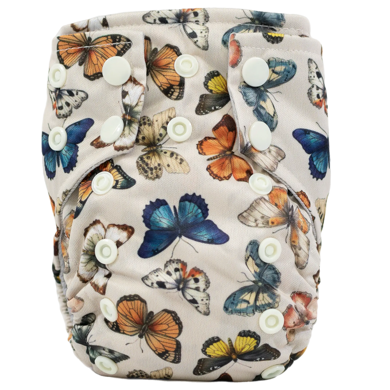 Tiny Tushies Newborn AIO Cloth Diaper with butterfly print and snap closures.