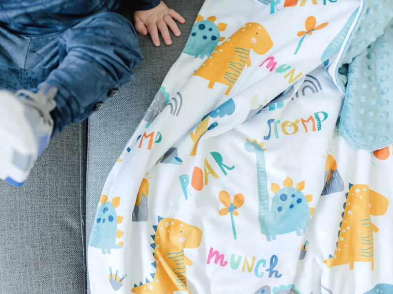 Baby & Toddler Minky Blanket with dinosaur pattern, blue and orange, soft premium quality fabric.