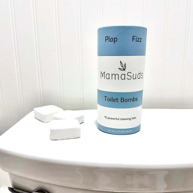 Non-toxic toilet bomb cleaning tabs with essential oils on tank.