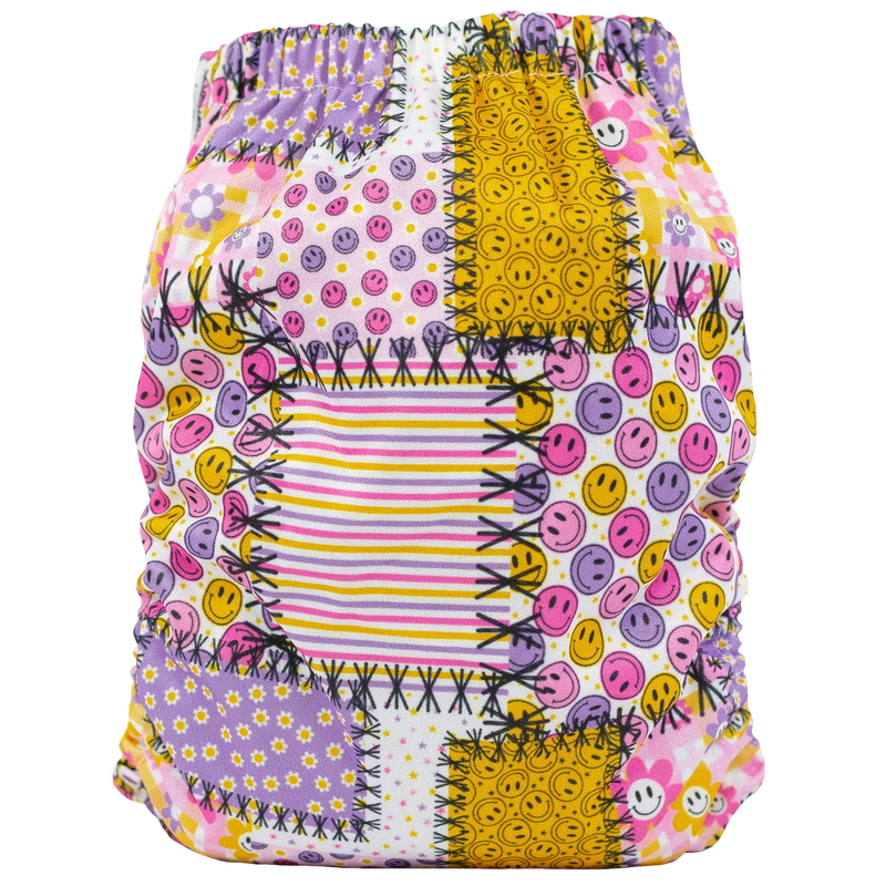 Slim Fit AIO Cloth Diaper with colorful patchwork design, fits babies 8-40lbs, eco-friendly and absorbent.