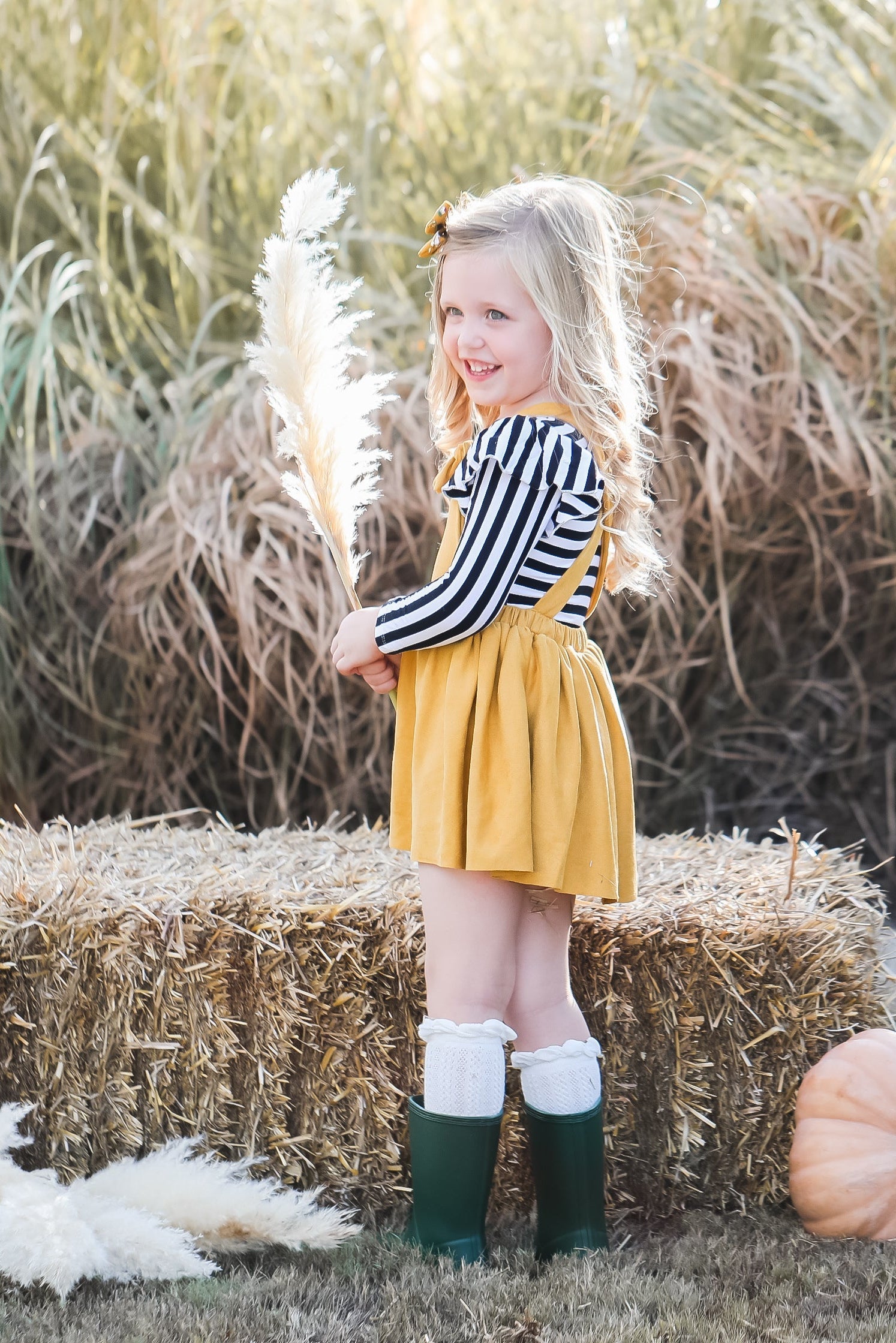 Mustard faux suede pinafore dress with crisscross adjustable straps in the back