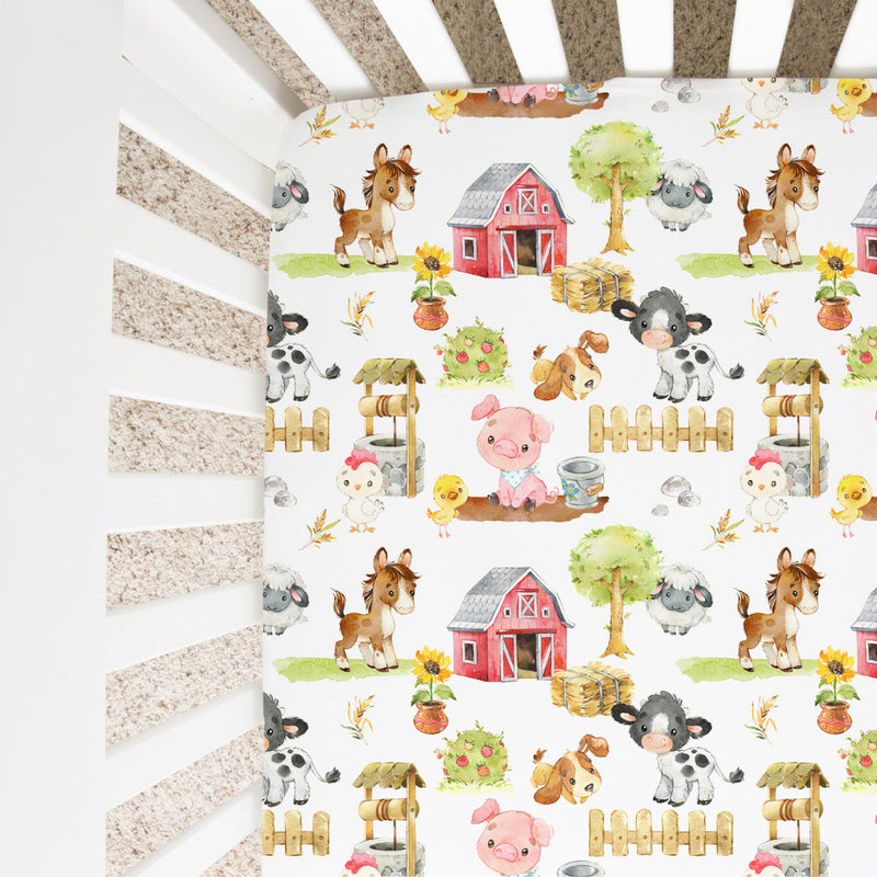 Fitted crib sheet with farm animals pattern in a crib setup.