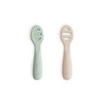 Set of flat baby feeding spoons, one solid and one with open slots, both with raised sensory dots along the sides.
