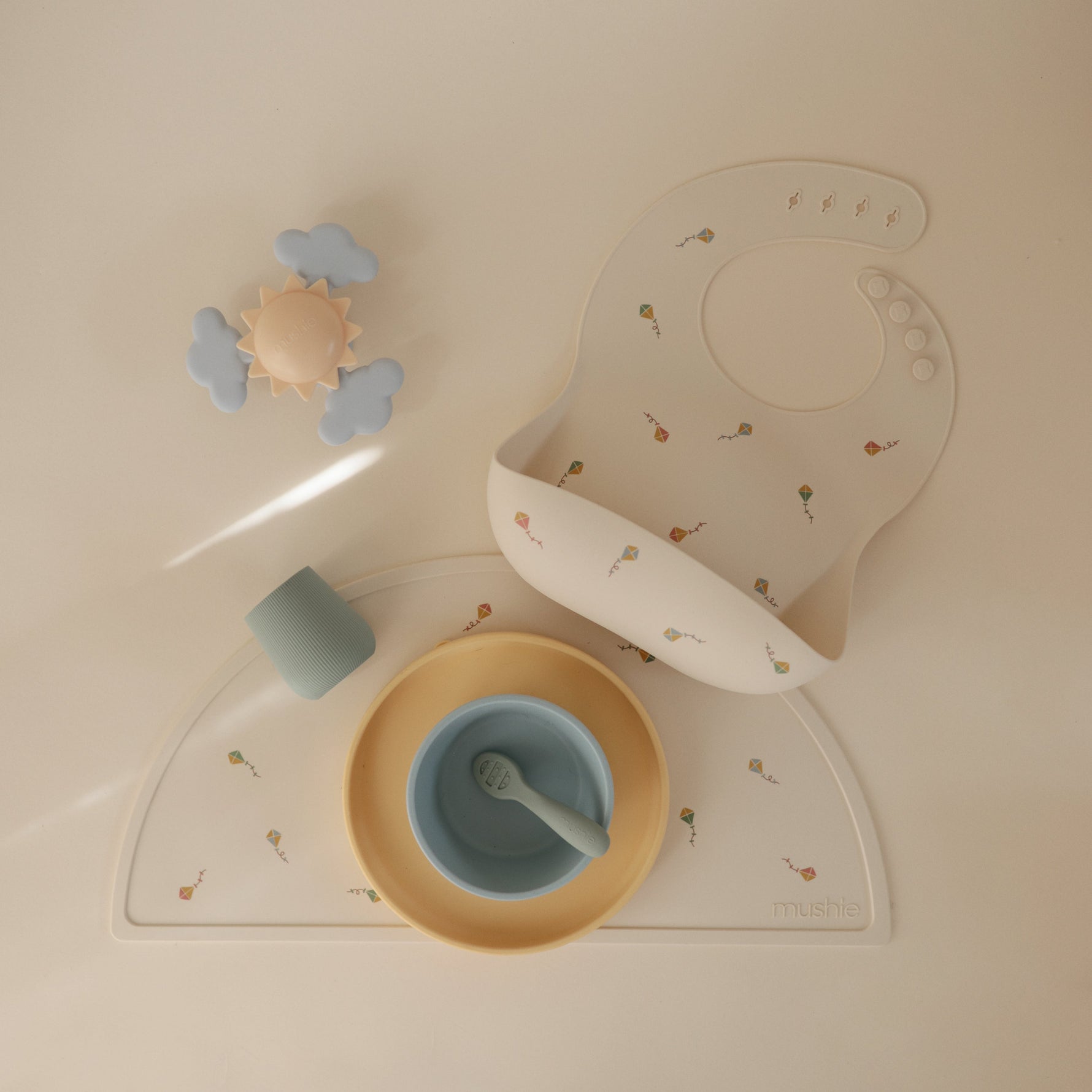 Mushie food-grade silicone baby placemat, non-slip & easy clean.