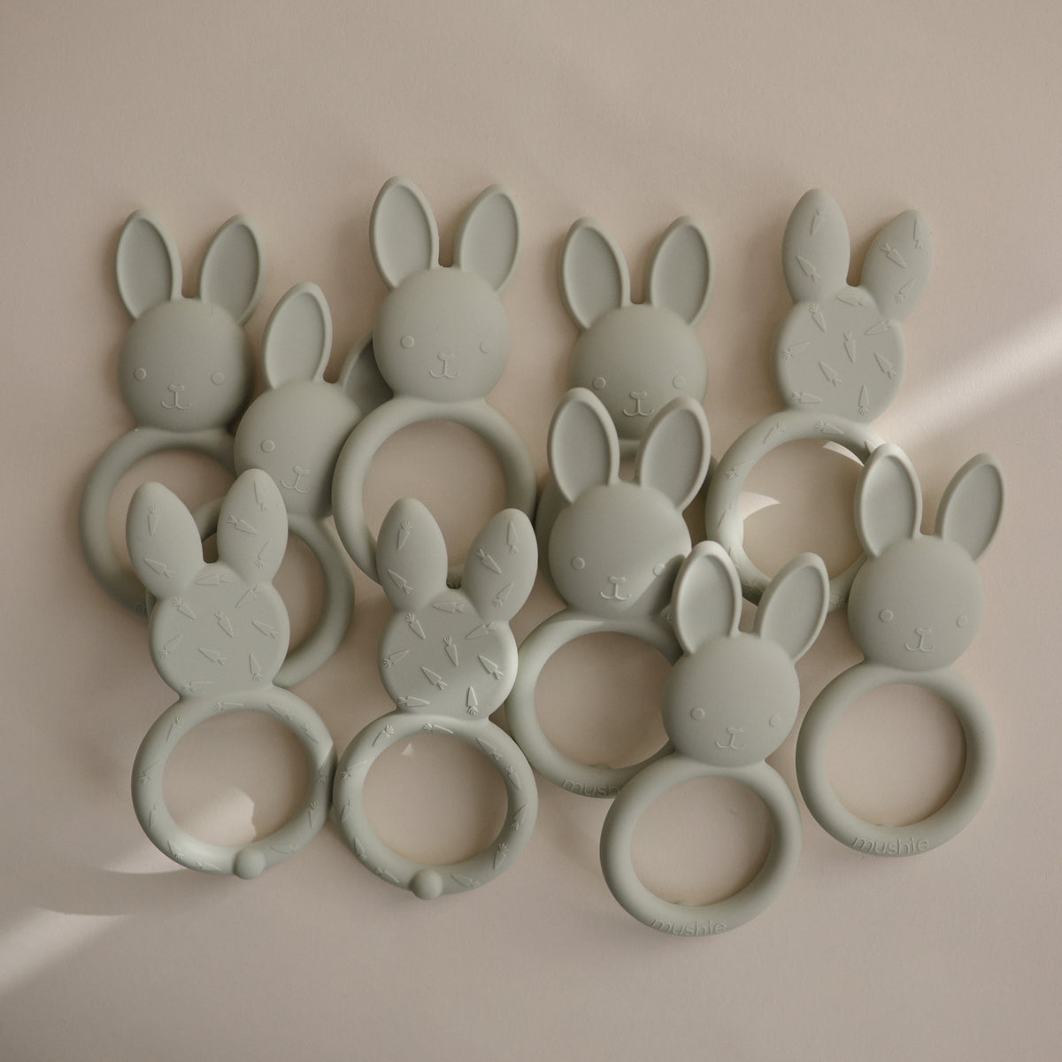 Mushie silicone bunny teether, soothing and safe for baby gums.