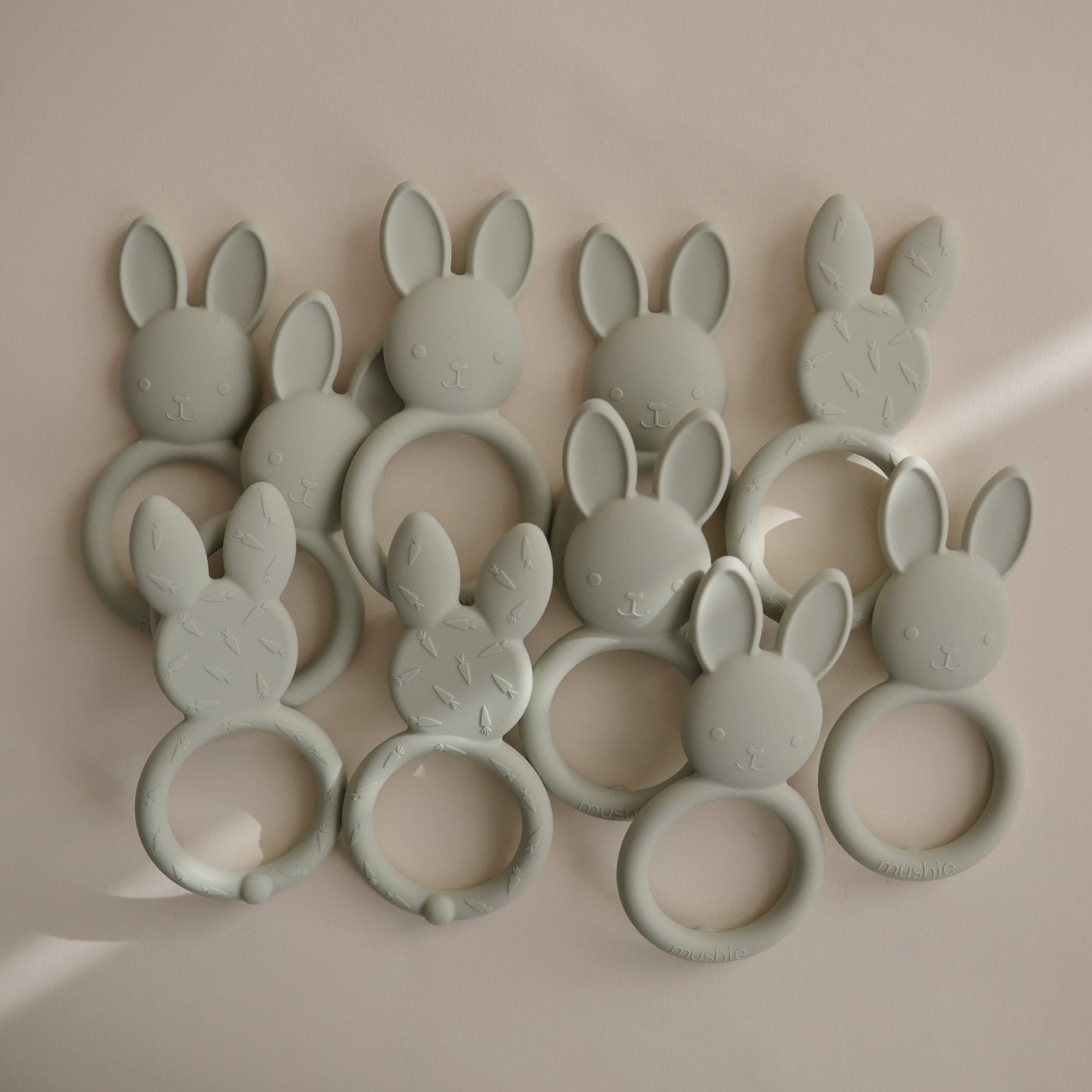 Mushie silicone bunny teether, soothing and safe for baby gums.